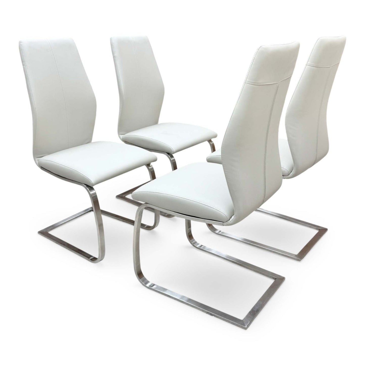 Side view for the Elis taupe dining chairs, highlighting the wipe-clean faux leather upholstery, ergonomic back support, and sturdy cantilever frame.