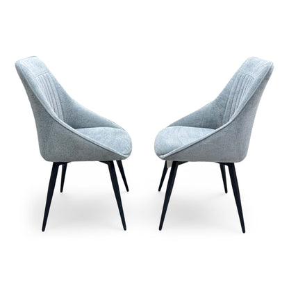 Side profile of the Crete swivel chair, emphasizing the elegant wrap-around curvature of the backrest and the clean, minimalist lines of the frame.