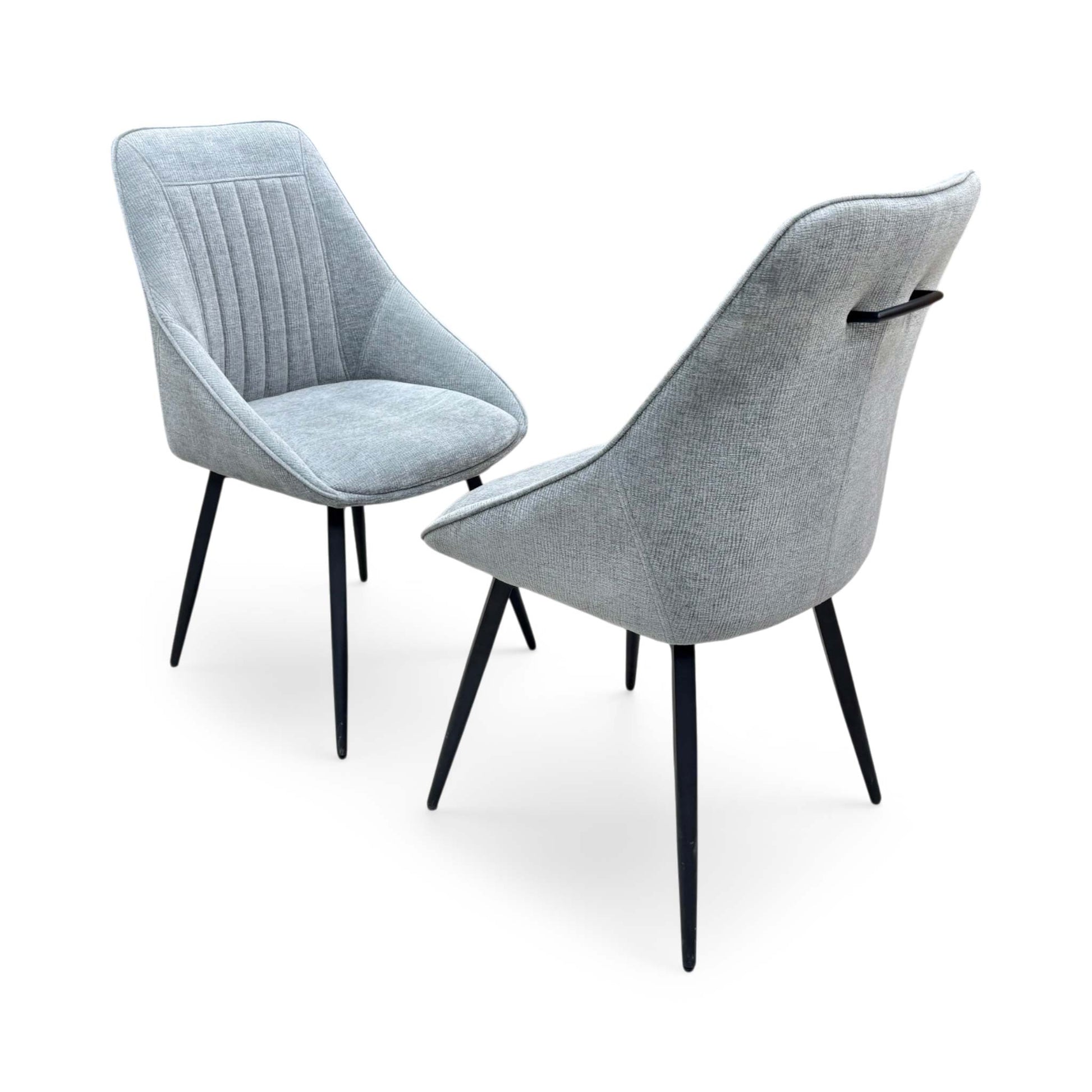 Side profile of the Crete swivel chair, emphasizing the elegant wrap-around curvature of the backrest and the clean, minimalist lines of the frame.