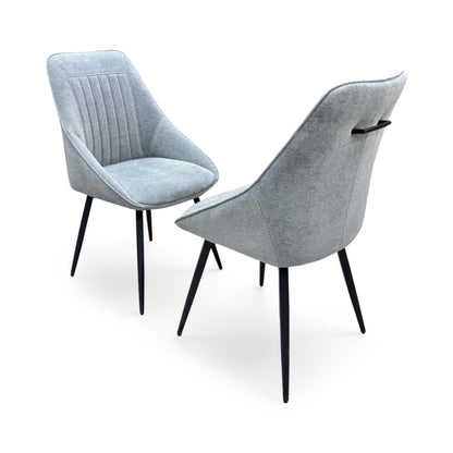 Side profile of the Crete swivel chair, emphasizing the elegant wrap-around curvature of the backrest and the clean, minimalist lines of the frame.