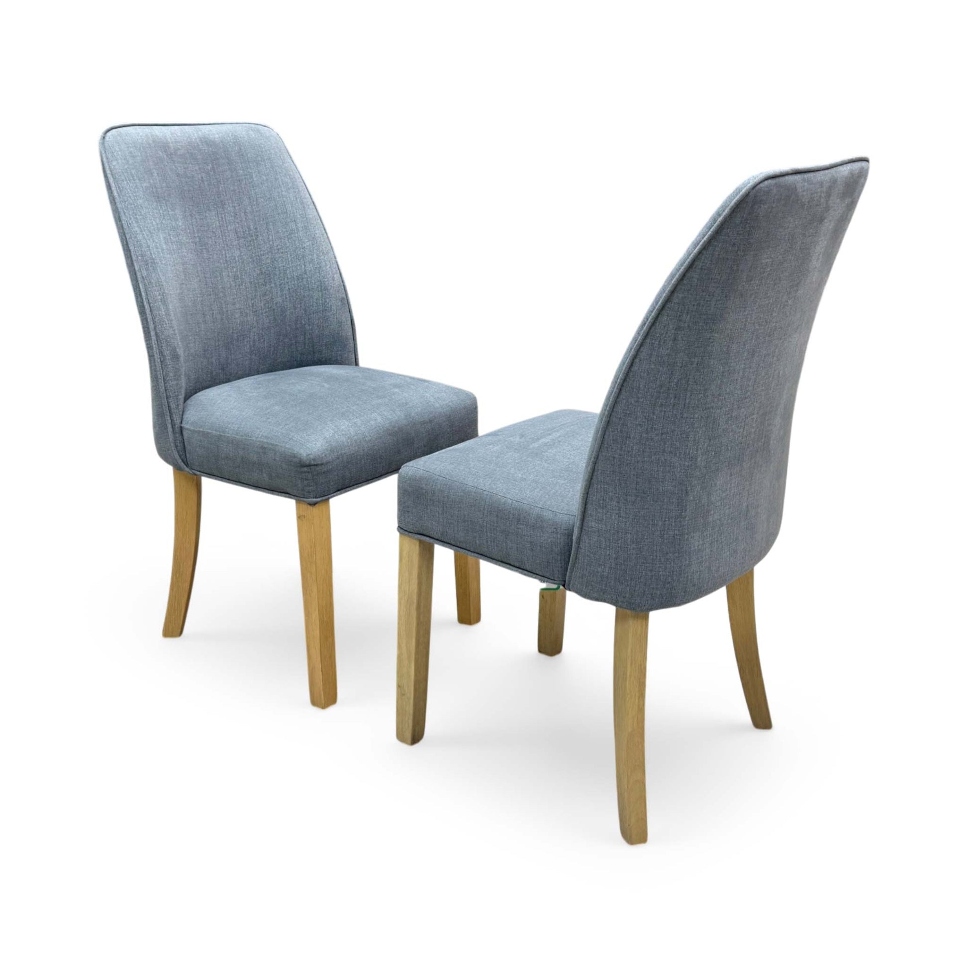Side profile of the Hamilton dining chair, showing the elegant curvature of the backrest and the straight, supportive design of the solid wooden legs.