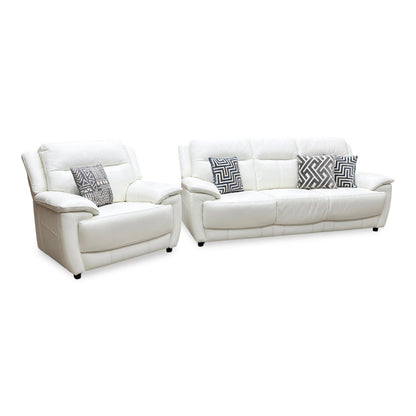 Side view of the Touch white leather sofa frame, demonstrating the ergonomic lumbar contouring, armrest thickness, and sturdy structural depth.