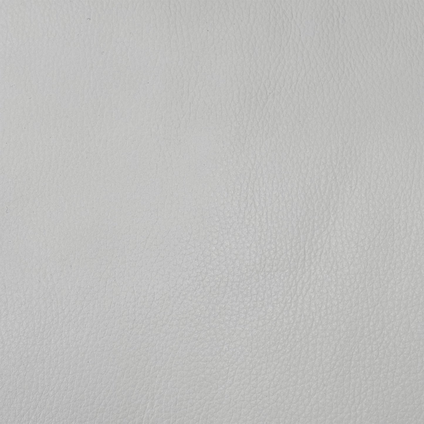 Close up view of the Touch NC-744D Star White leather upholstery, emphasizing the high-quality grain texture, supple finish, and durable linear accent stitching.