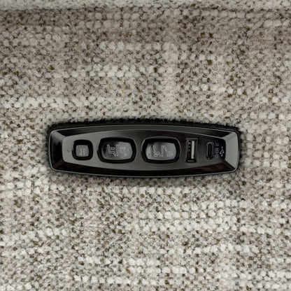Close up view of the Nova MGA-R04 beige fabric upholstery, emphasizing the high-quality woven texture, durable seams, and integrated power recliner control switches.