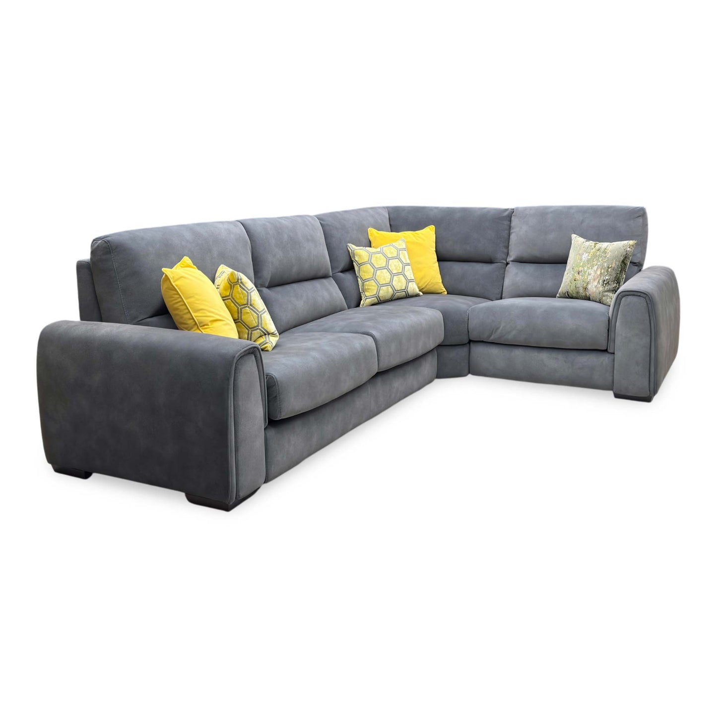 Side profile view of the Flex corner sofa, illustrating the depth of the chaise lounge section, supportive armrest cushioning, and sleek low-profile feet.