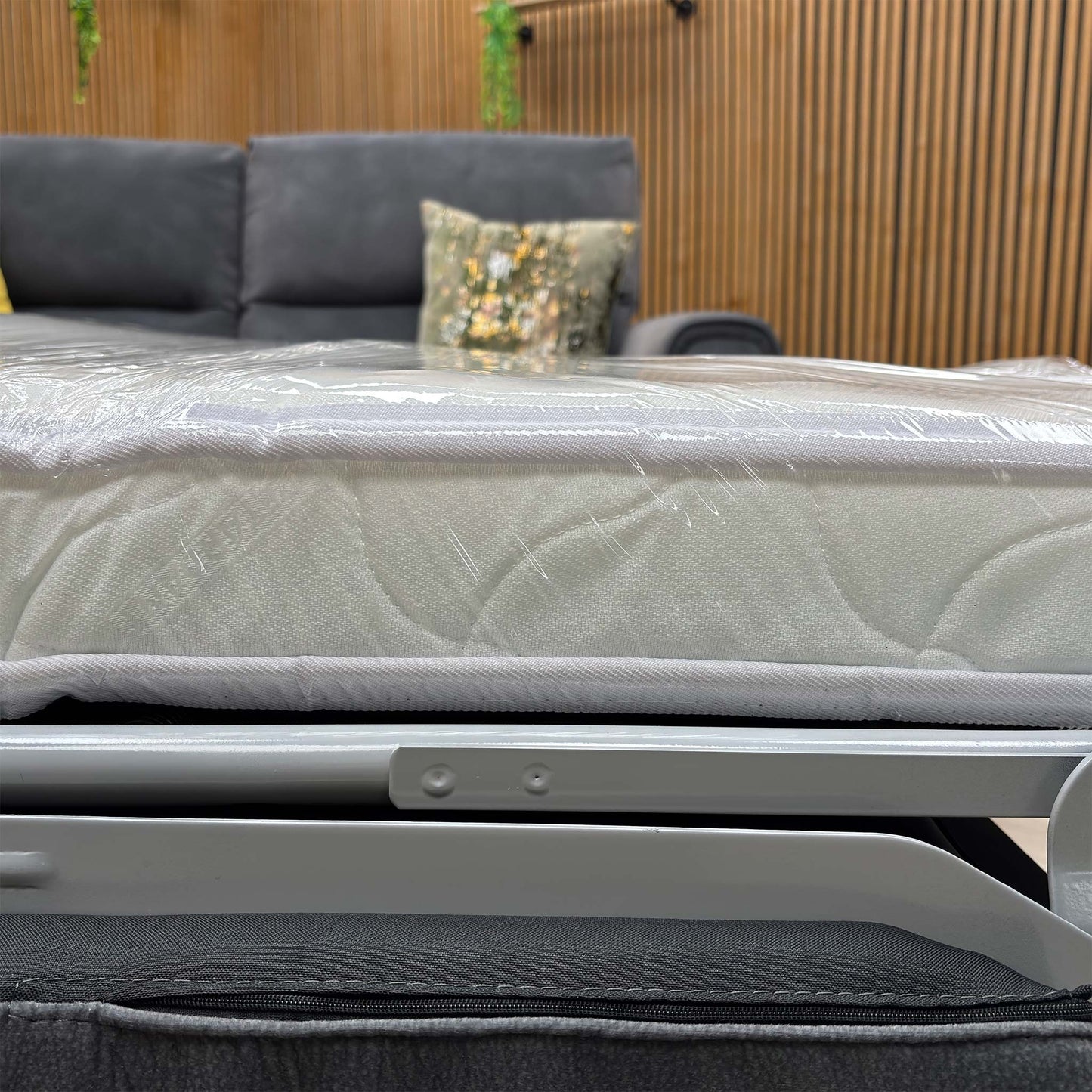 Close up view of the Flex SFA-PEY-R08 graphite grey fabric upholstery, highlighting the durable woven texture, tight contrast stitching, and premium finish.