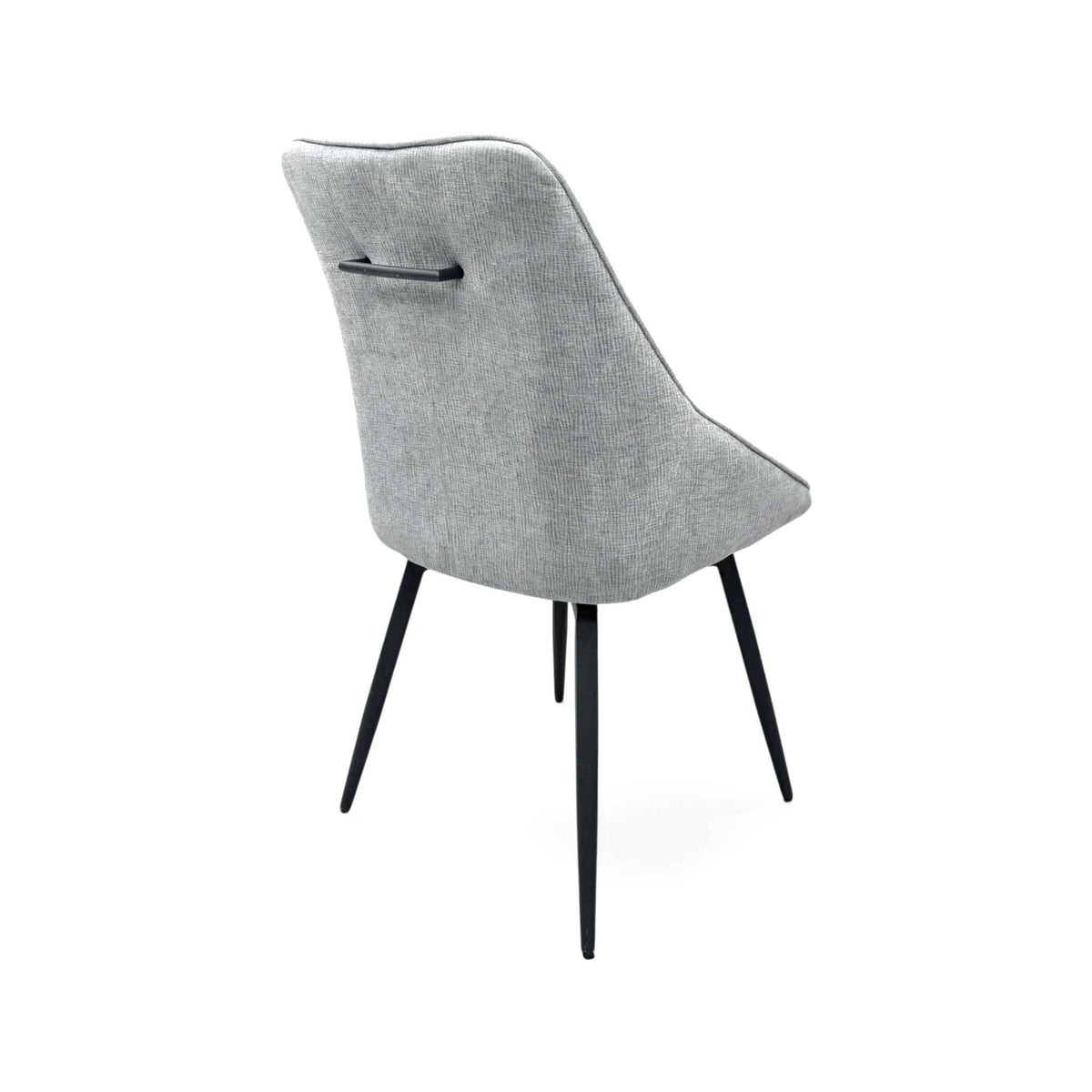 Crete silver fabric swivel dining chair from the rear left, showing the back handle
