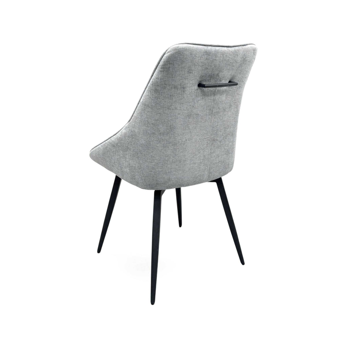 Crete silver fabric swivel dining chair from the rear right with tapered black metal legs
