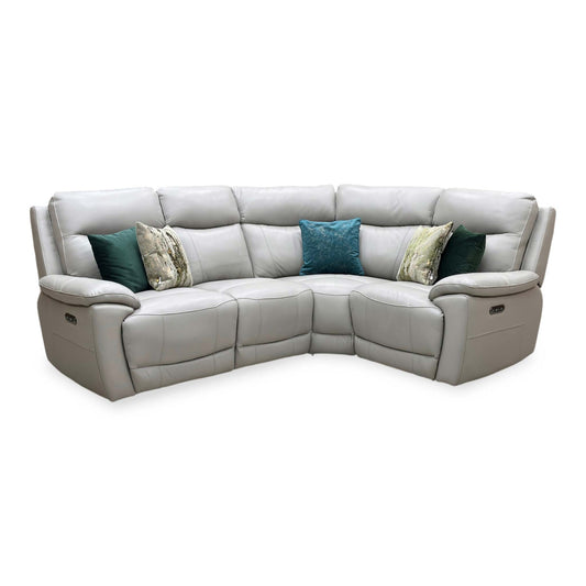 Front view of the Sloane small corner sofa in New Grey leather, showcasing its compact L-shaped configuration, modern clean lines, and premium tailored stitch panels.