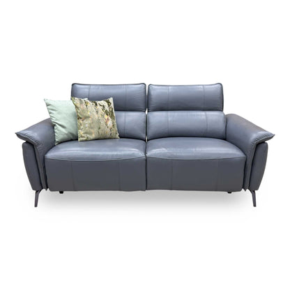 Front-facing profile of the lavender grey leather sofa, showcasing its high-back lumbar design, deeply padded armrests, and clean tailored seams.