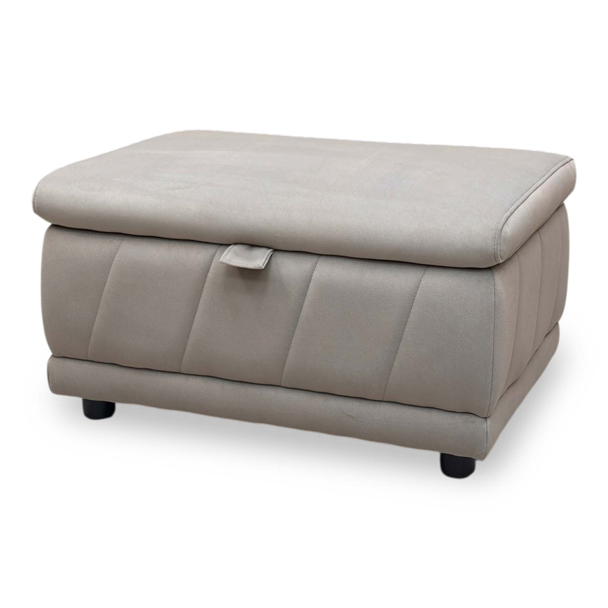 Angle view demonstrating the footstool's uniform height, clean linear proportions, and tightly upholstered base paneling.
