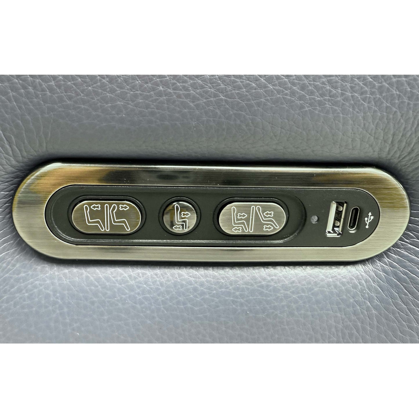 Detailed view of the integrated sleek brushed metal power control switch panel on the outer side, featuring built-in USB device charging ports.