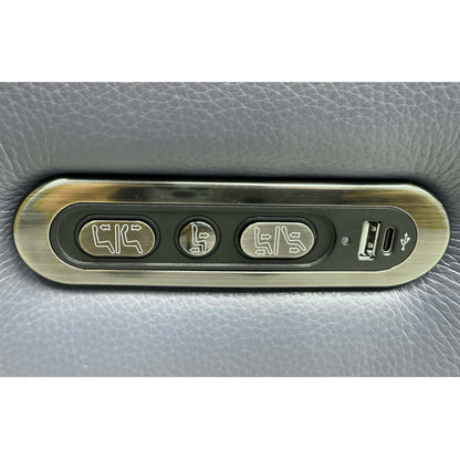 Detailed view of the integrated sleek brushed metal power control switch panel on the outer side, featuring built-in USB device charging ports.