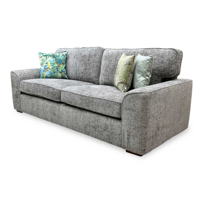 Side perspective look at the sofa frame profile, demonstrating its balanced seating depth, supportive armrest height, and low-profile modern block feet.