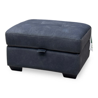 Side profile view demonstrating the footstool's uniform height, clean linear proportions, and tightly upholstered base paneling.