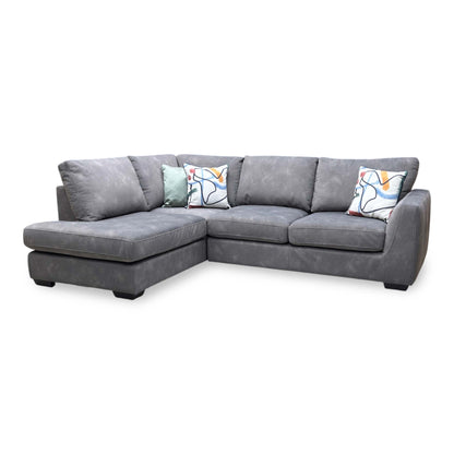 Front-facing profile of the mocha grey corner sofa, showcasing its compact L-shaped design, clean linear back cushions, and deep chaise lounge section.