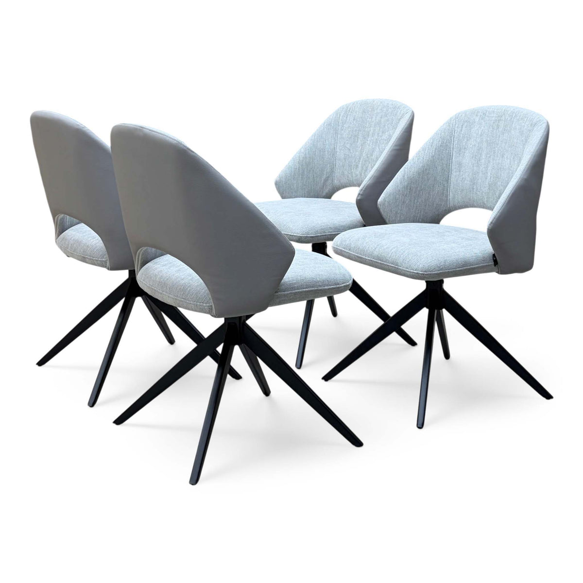 The 4 grey Raul swivel dining chairs grouped together, front and back angles