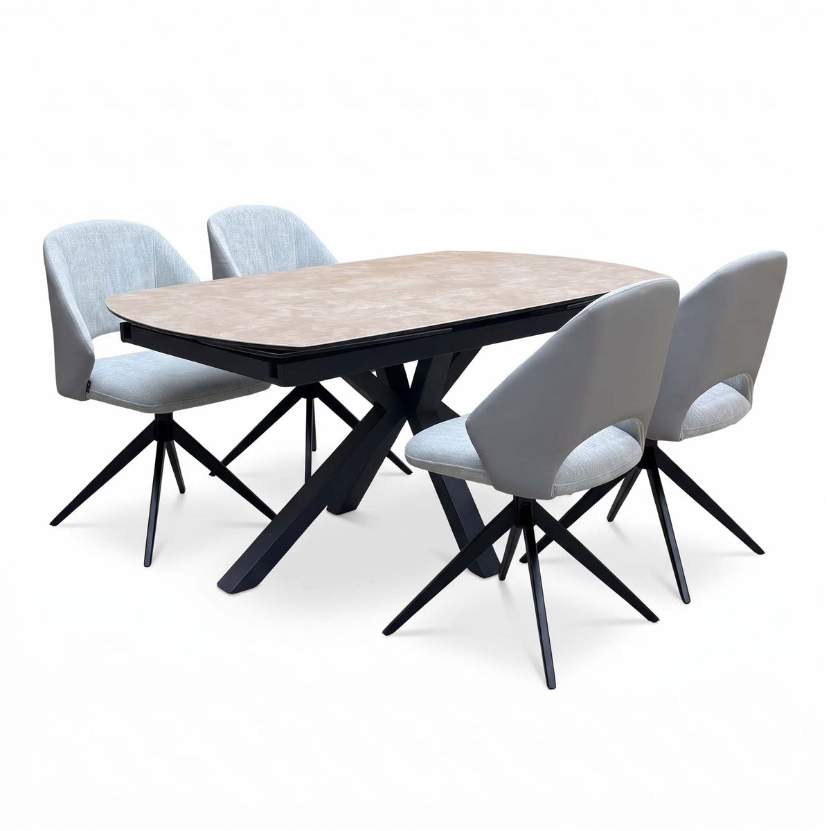 Raul argile ceramic dining table set from the right, two grey swivel chairs in front