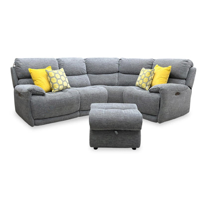 Full view of the Link right-hand facing corner sofa in charcoal grey fabric, showcasing its spacious sectional layout, power recliner seat, adjustable headrests, and matching footstool.