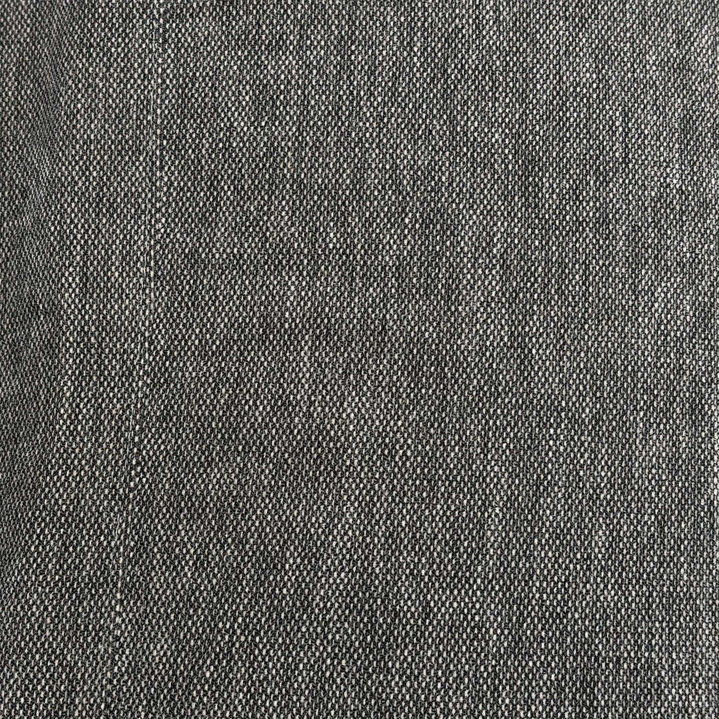 Close-up view of the matching Link charcoal grey fabric footstool opened up, revealing a spacious internal storage compartment for blankets, pillows, and living room clutter.