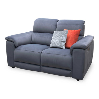 Side view of the Genius fabric power recliner sofa frame, illustrating the supportive armrest cushioning profile and the backrest wall clearance required for a full recline.