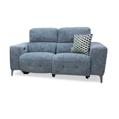 Front view of the New York 2-seater power recliner sofa in silverish blue fabric, showcasing its modern compact silhouette, deeply padded back cushions, and sleek track arms.