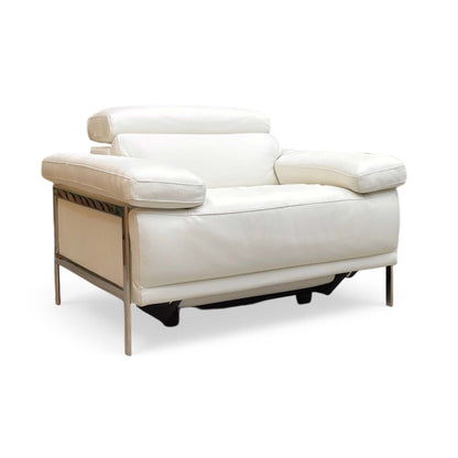 Side view of Nicoletti Theron Torello luxury white leather recliner chair styled in a modern living room setting. The designer Italian armchair is paired with contemporary home decor, an accent rug, and ambient lighting to illustrate upscale interior styling.