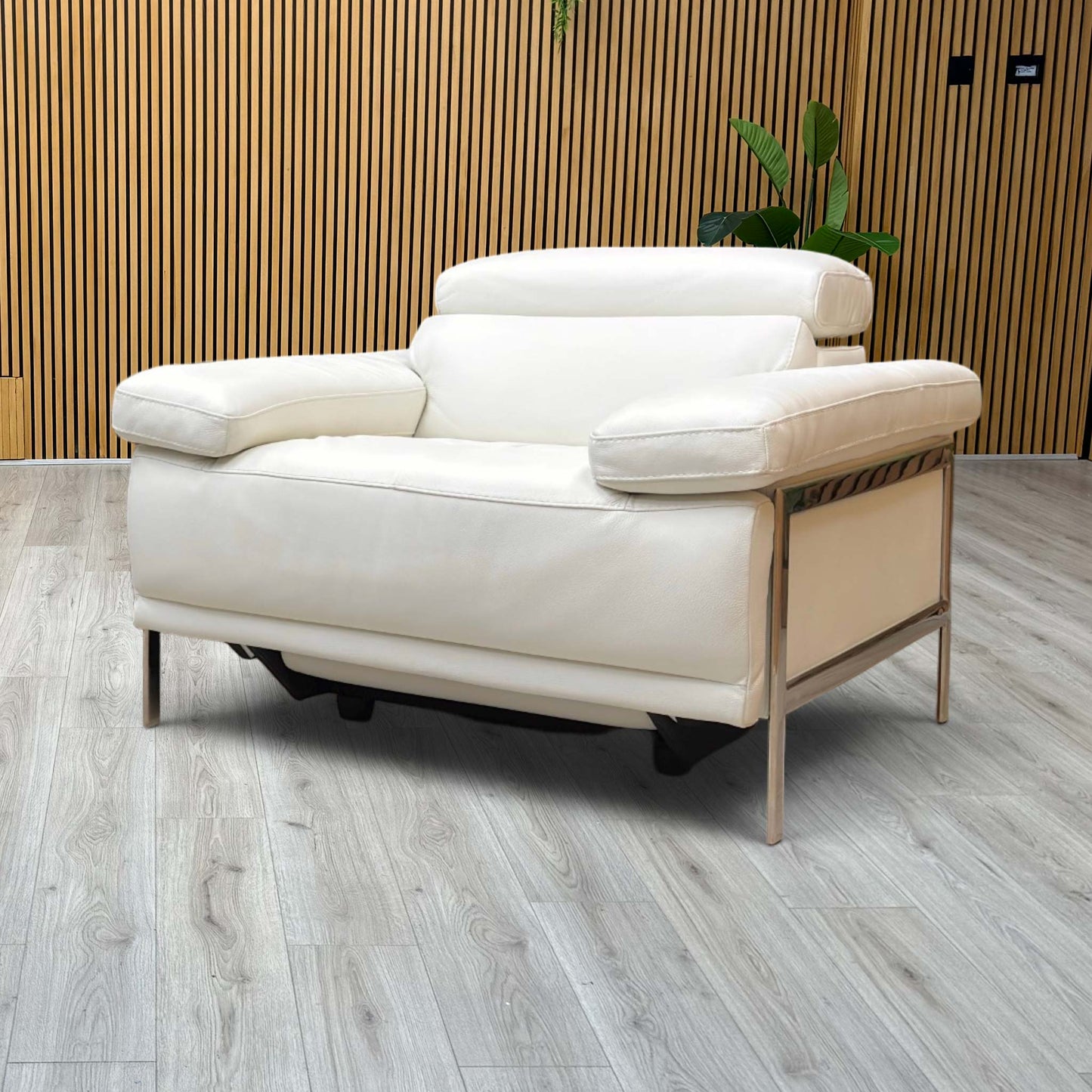 Lifestyle view Nicoletti Theron Torello white leather power recliner chair in fully reclined position. Image displays the smoothly extended electronic footrest and tilted backrest, highlighting the dual-motor specialized comfort motion and seamless mechanism transition.