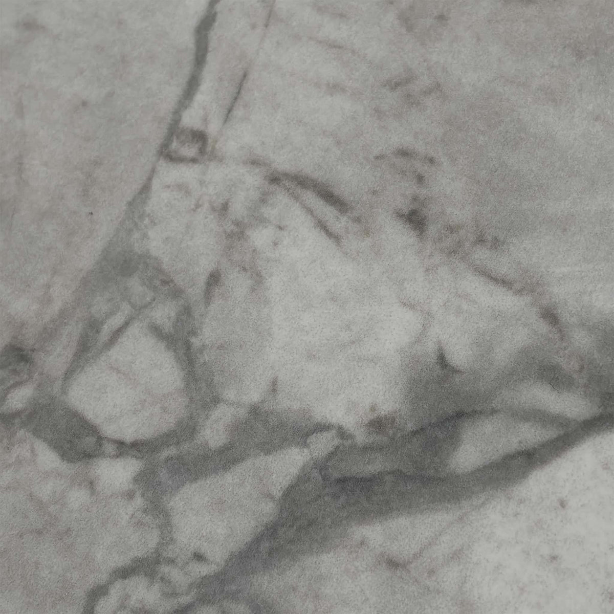 Close-up of the white marble-effect ceramic top used on the Crete extending dining table