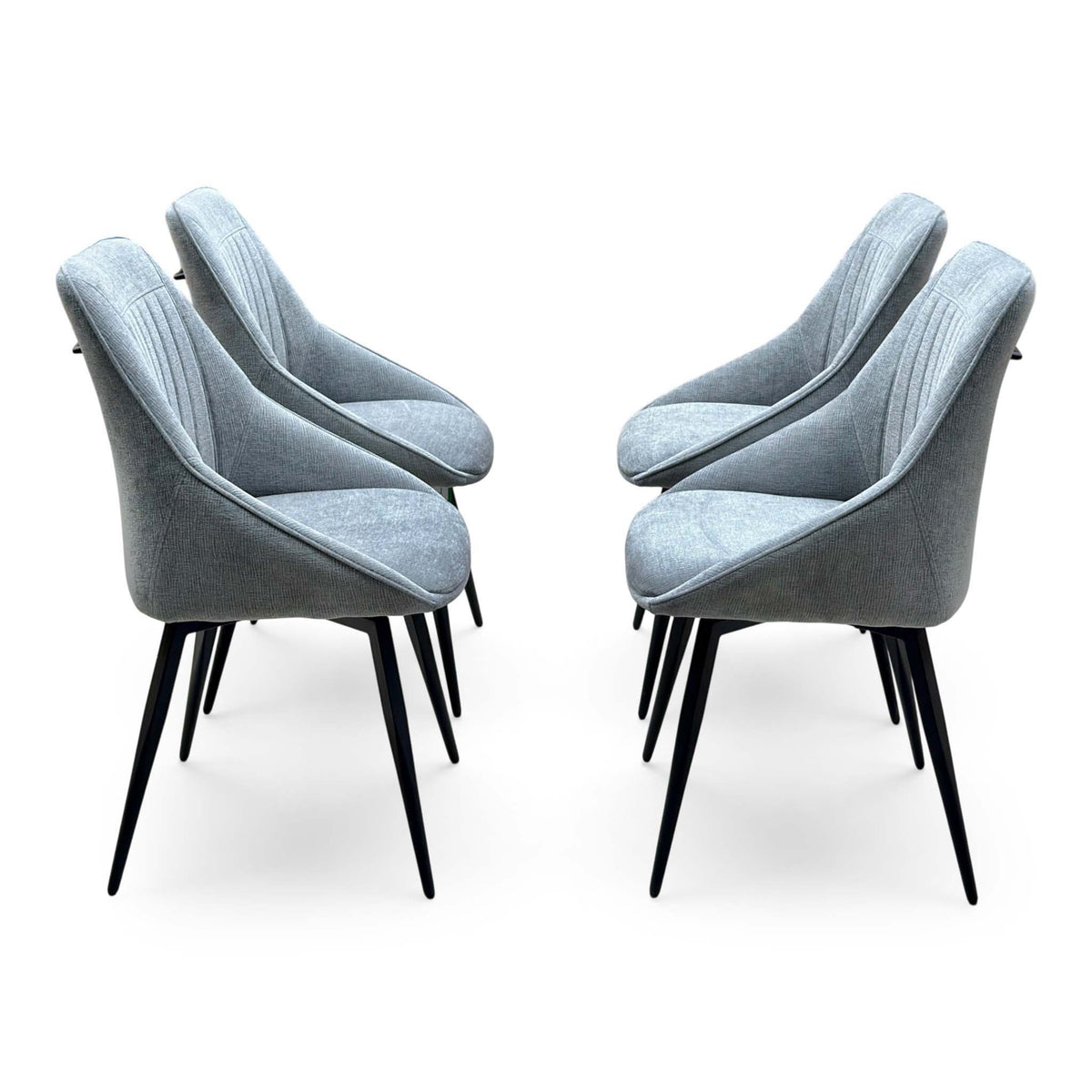 The four dark grey swivel chairs from the Crete dining set arranged in two facing pairs