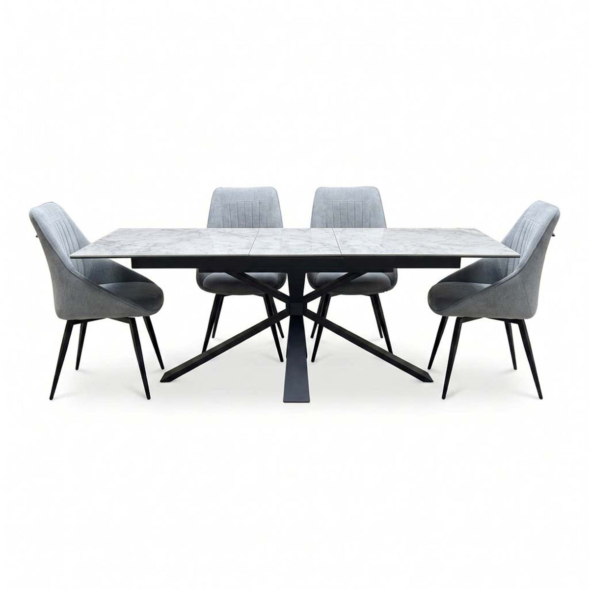 Crete ceramic top extending dining table set with four dark grey swivel chairs, straight-on view on white
