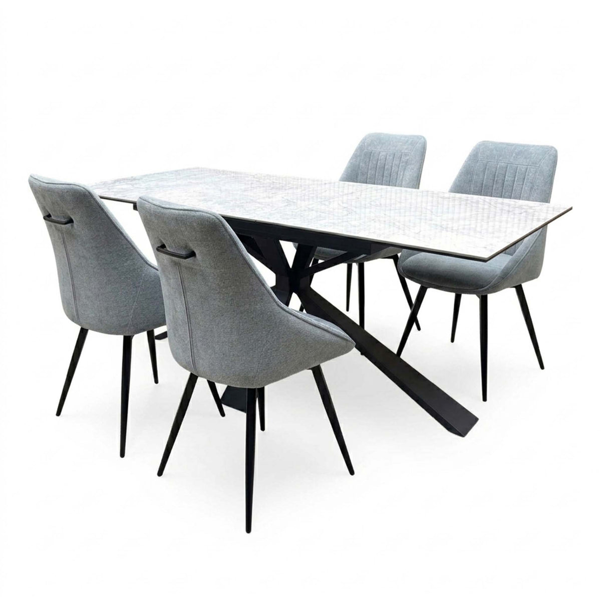 Crete ceramic top dining table and four dark grey swivel chairs, angled view showing the black spider base