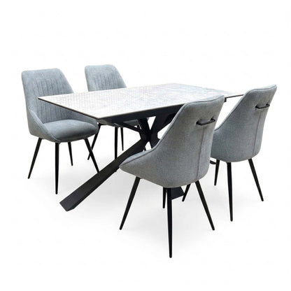 Crete ceramic top dining table and four dark grey swivel chairs from the right, two chairs pulled out