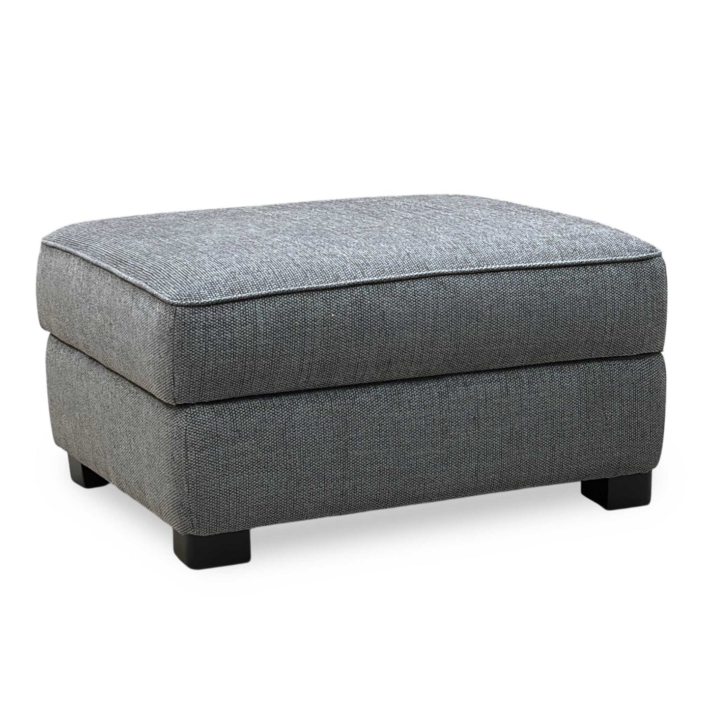 Gray upholstered ottoman on a white background