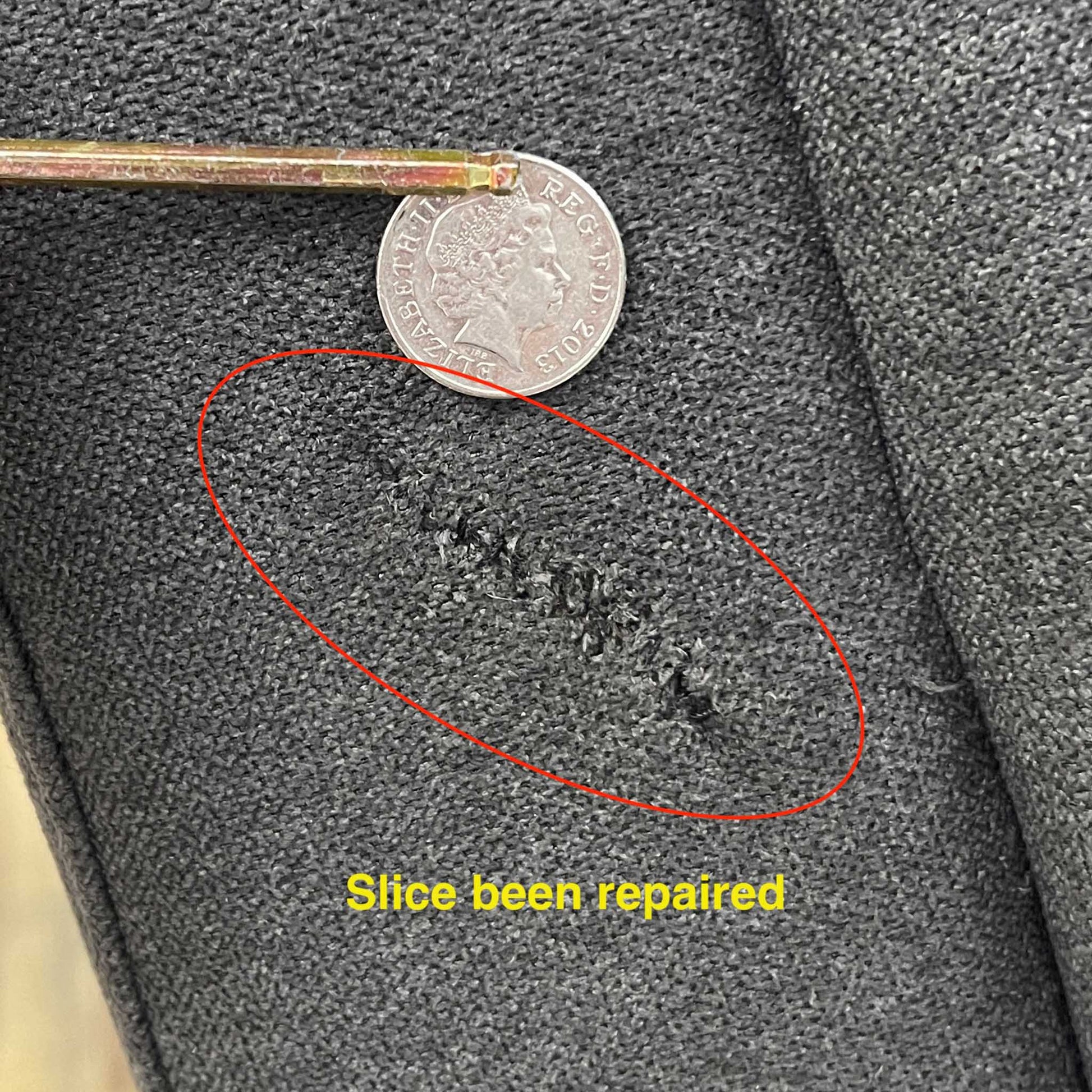 Damage on the sofa upholstery.Close-up view of the manual pull-latch mechanism located on the outer side panel, highlighting the clean integration into the soft chenille upholstery.