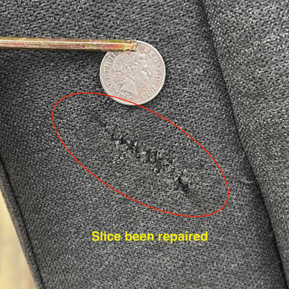 Damage on the sofa upholstery.Close-up view of the manual pull-latch mechanism located on the outer side panel, highlighting the clean integration into the soft chenille upholstery.