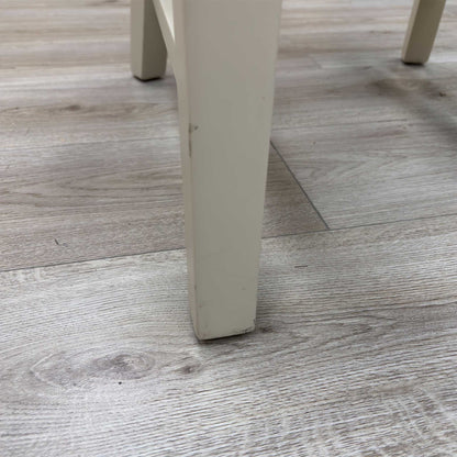 Close-up view from a high angle looking down at the seat and backrest junction, displaying the flawless edge finishing, tight tolerances, and pristine tailored construction lines.Damage on chair Legs.
