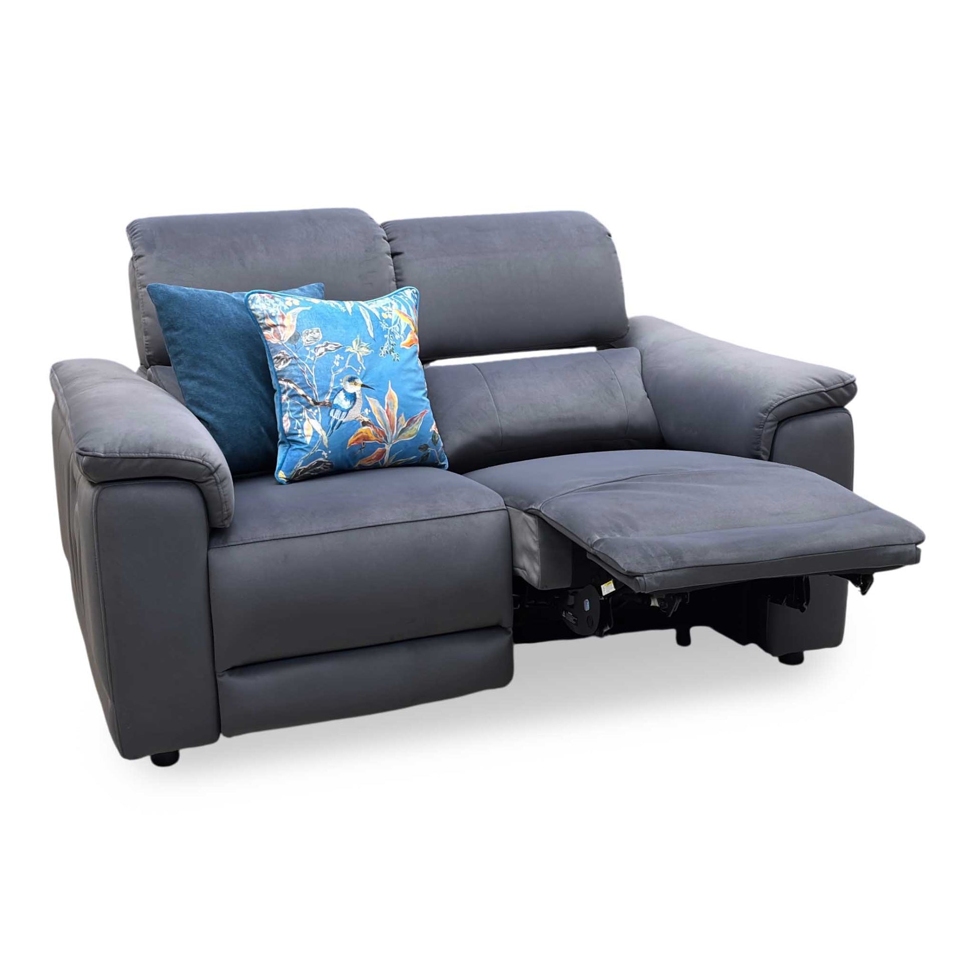 Gray sofa with a floral pillow on a white background
