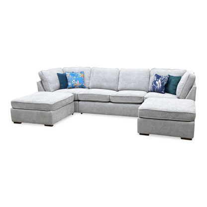Side perspective profile view of one of the extended chaise sections, demonstrating the deep lounging clearance, relaxed low-profile transitions, and streamlined armrest tailoring.