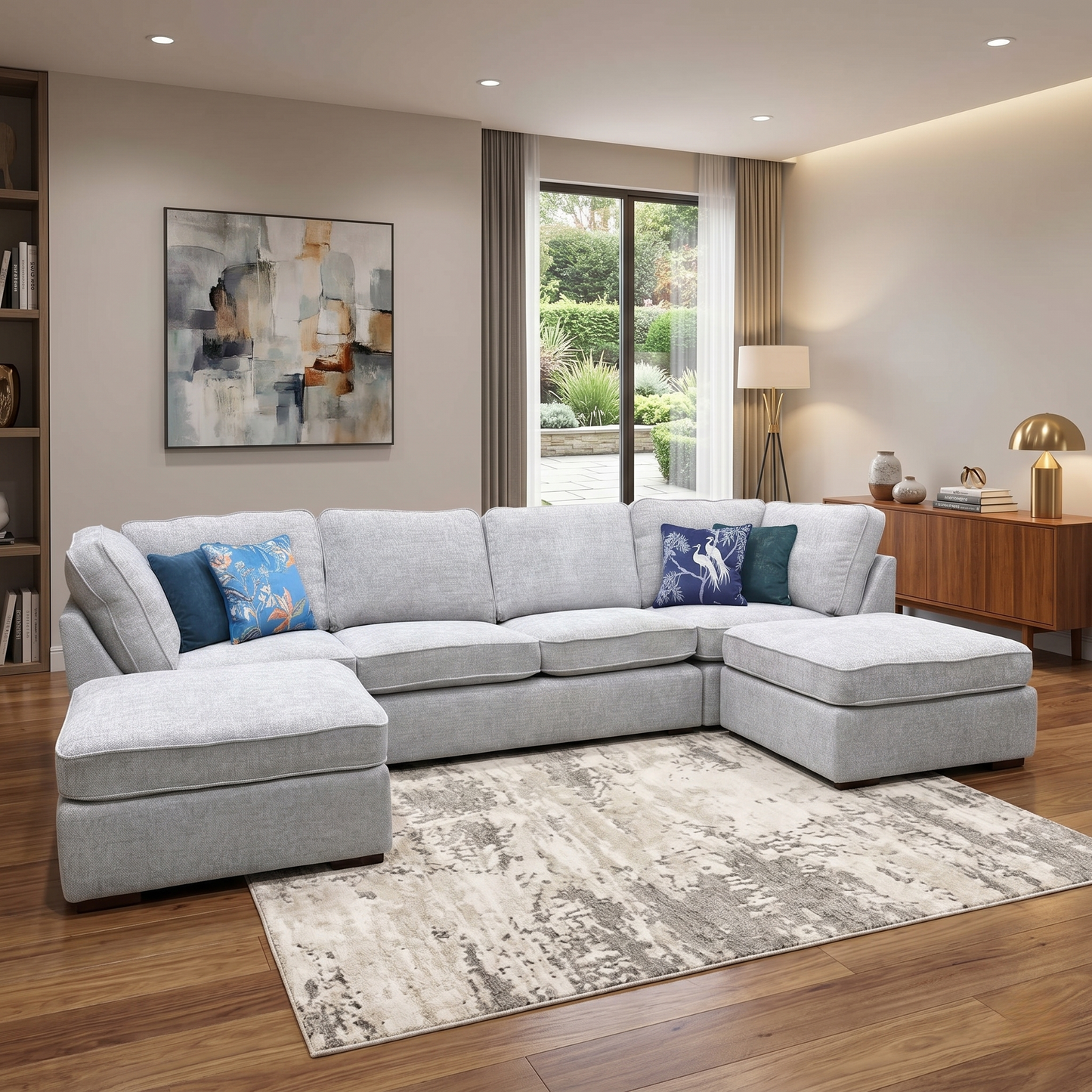 Styled large modern open-plan living room lifestyle layout featuring the Emilia silver chenille U-shaped corner sofa arranged as the ultimate luxurious family entertainment centerpiece.
