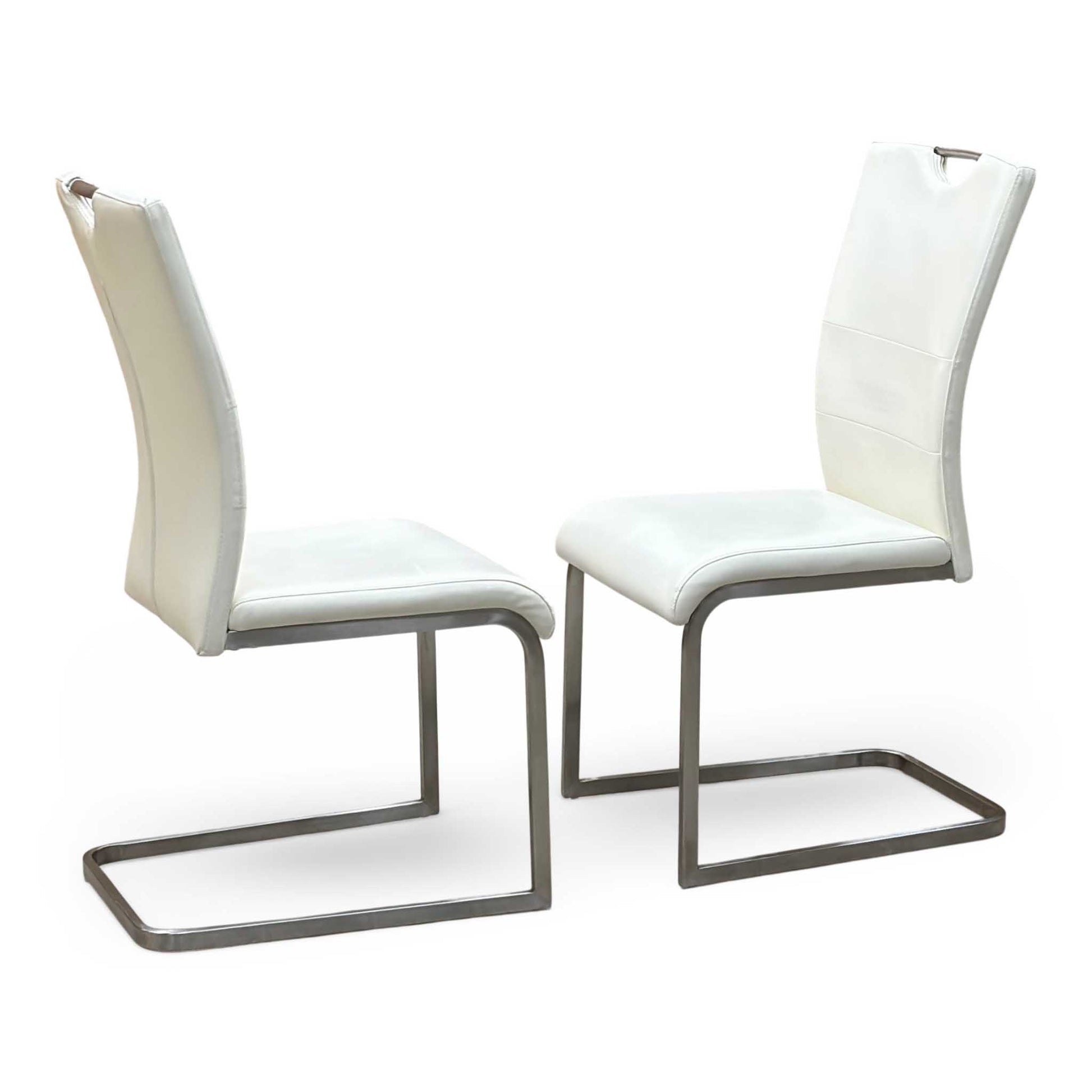 Full View ‘Bianco’ contemporary dining chair set, showcasing a pair of sleek chairs beautifully upholstered in crisp White faux leather supported by minimalist chrome cantilever bases.