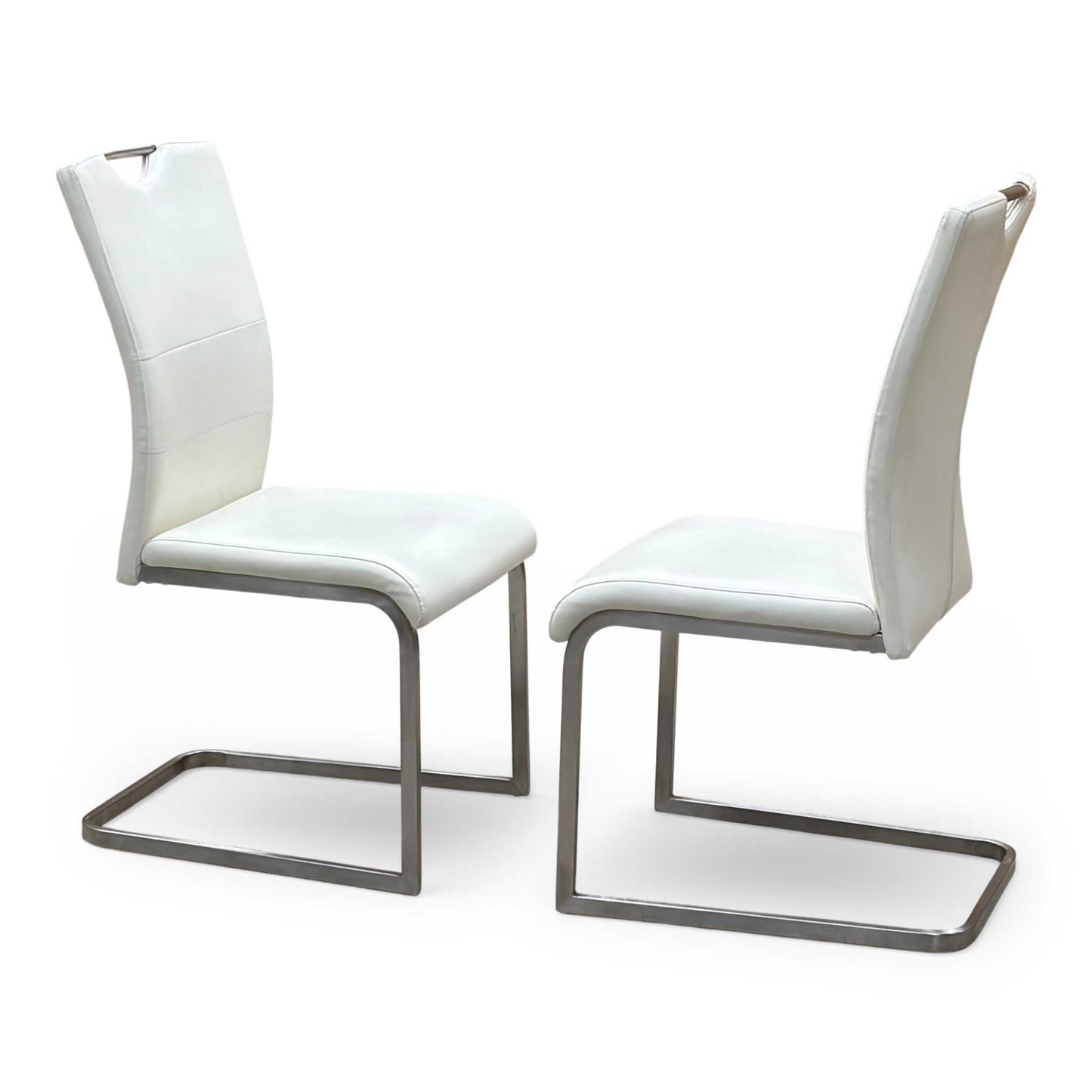 Side perspective profile view of a chair, demonstrating the classic gravity-defying cantilever suspension curve, supportive backrest angle, and sleek polished chrome metal finish.