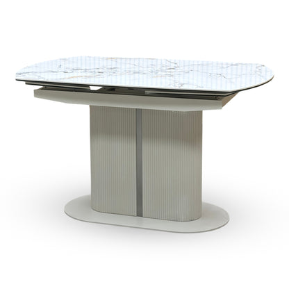 Side view of the modern architectural pedestal base on the Avorio ceramic dining table. Highlights the heavy-duty fluted or ribbed column support frame and the sleek matching floor-anchoring base plate.