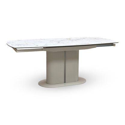Full view of Avorio Ceramic swivel top extending dining table front view in compact closed position. Contemporary kitchen table featuring a bright white and cream marble-effect ceramic surface on a sculptural, textured pedestal base.