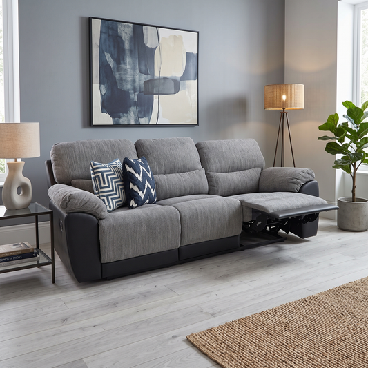 Styled upscale contemporary living room lifestyle layout featuring the Santori Black Charcoal fabric and faux leather 3-seater high-back recliner sofa arranged as a comfortable centerpiece.