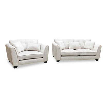 Mariah Dapple ivory fabric 3 seater sofa and snuggler chair set, angled from the right with scatter cushions