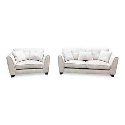 Front view of the Mariah Dapple ivory fabric 3 seater sofa and snuggler chair side by side