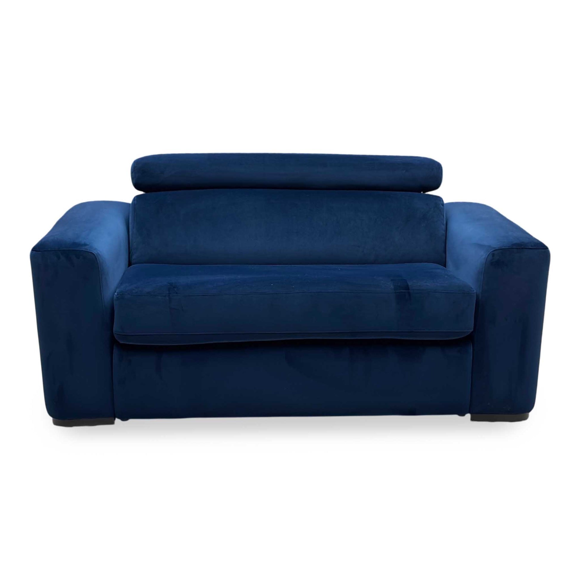 Front-facing individual view of the Infinity large armchair in its standard seating configuration, showcasing its wide layout, thick supportive cushions, and neat uniform tailoring.