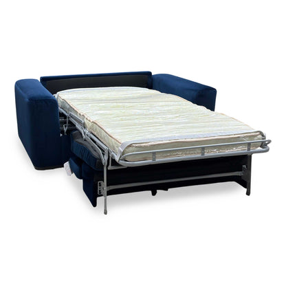 Side perspective profile view of the unit fully converted into a flat pull-out single sofa bed, demonstrating a completely level, extended sleeping platform with integrated headrest alignment.