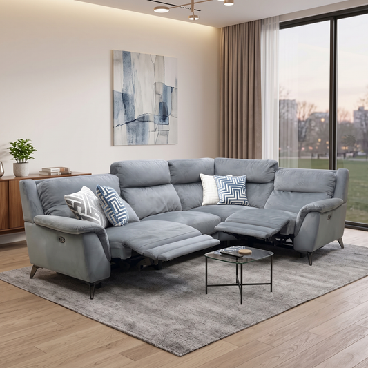 Styled upscale contemporary living room lifestyle layout featuring the Contempo pewter grey fabric power reclining corner sofa arranged as a luxurious, spacious entertainment centerpiece.